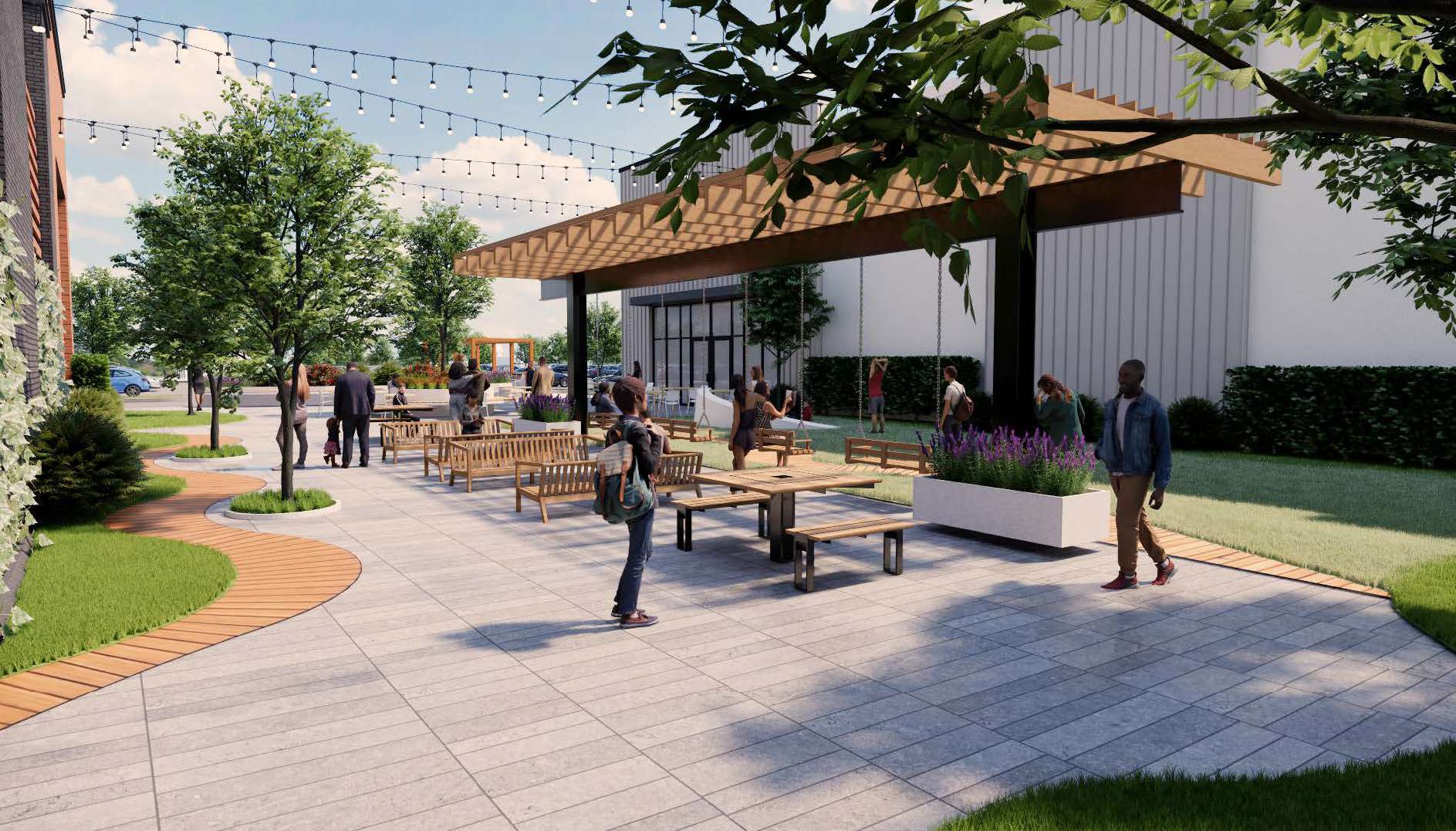 Outdoor courtyard with string lights, trees, wooden benches, and people chatting near a modern building.