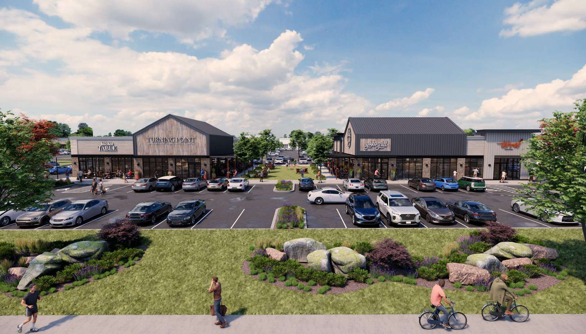 Exterior rendering of a modern outdoor shopping center with two row-style storefronts, a central green plaza, and parking lots under a blue sky.",